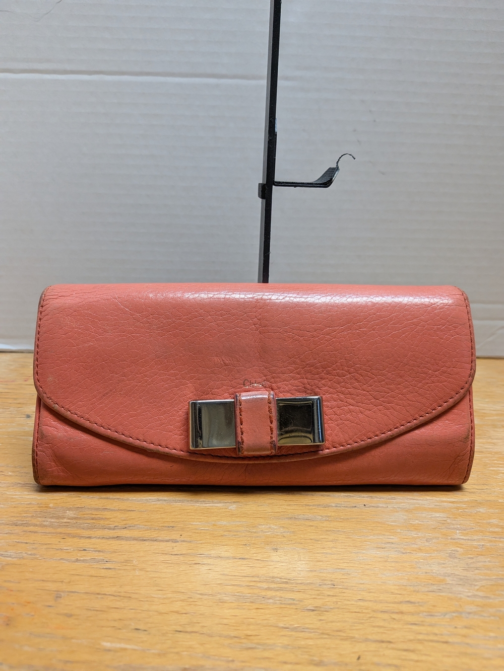 Chloe Coral Leather Clutch with Silver Bow Detail